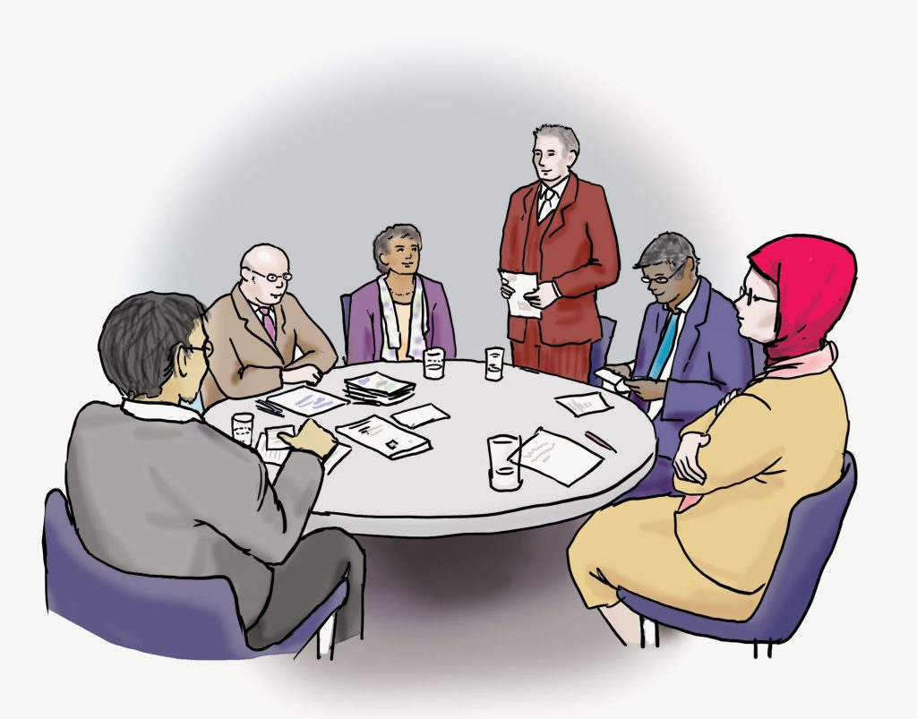 Illustration: Team-Besprechung Eine Gruppe von Personen sitzt an einem Tisch. Eine Person steht und spricht. Die anderen hören zu.